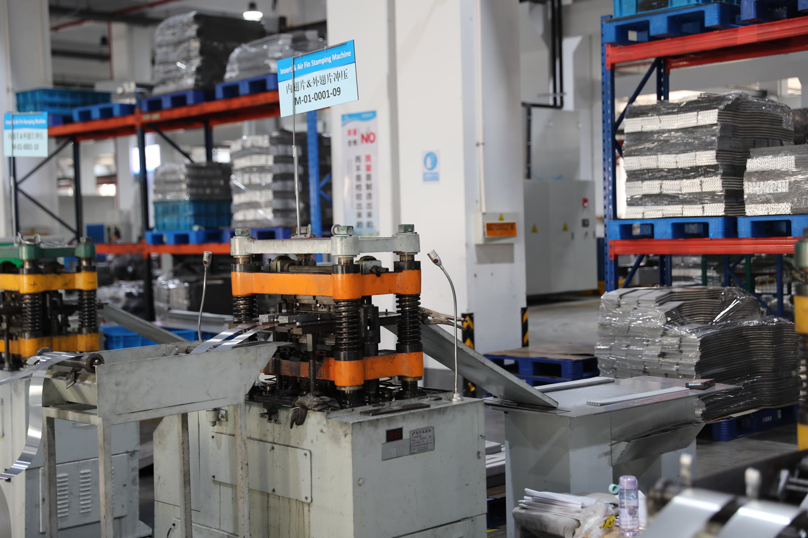 Bar-plate aluminum fin stamping and forming presses with semi-finished parts on shelving