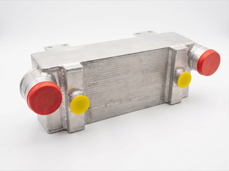 Liquid-to-liquid heat exchanger skid for process and closed-loop cooling circuits